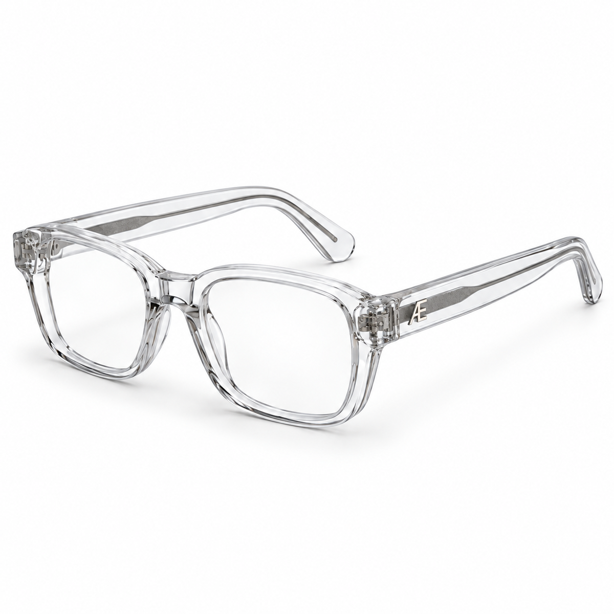 ATÉN Crystal Clear glasses with Everyday Mode lenses with a subtle warm tint, open in a three-quarter view on white; silver temple cores visible.
