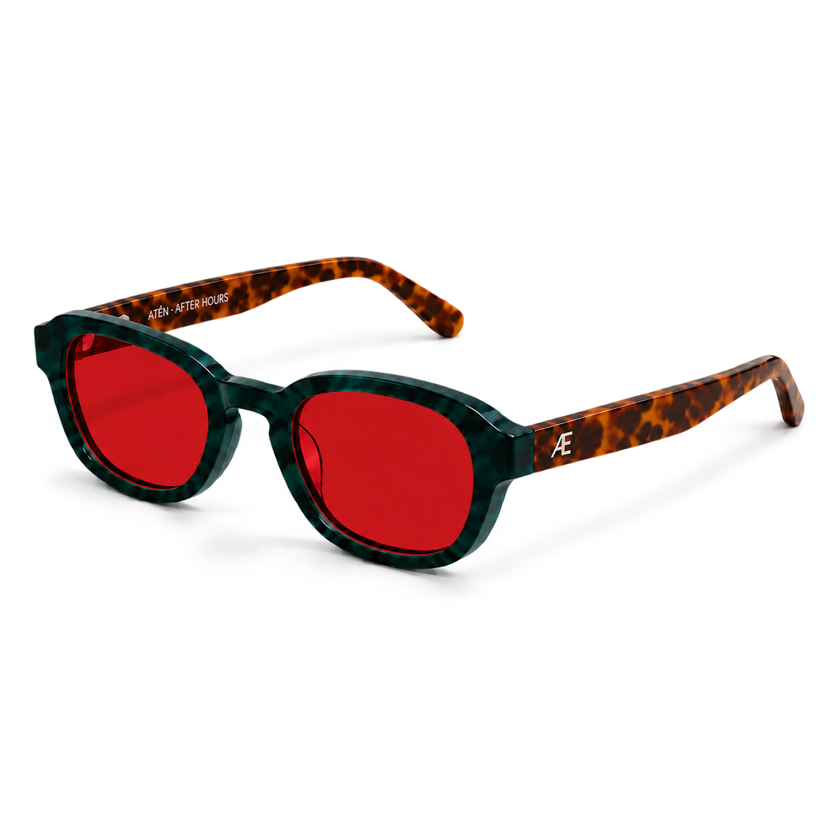 Open ATÉN Forest/Tortoise glasses with deep red After Hours lenses in a front-right three-quarter view; forest-green marbled front, brown tortoiseshell temples, silver monogram and ATÉN · AFTER HOURS inner-temple inscription on ivory.