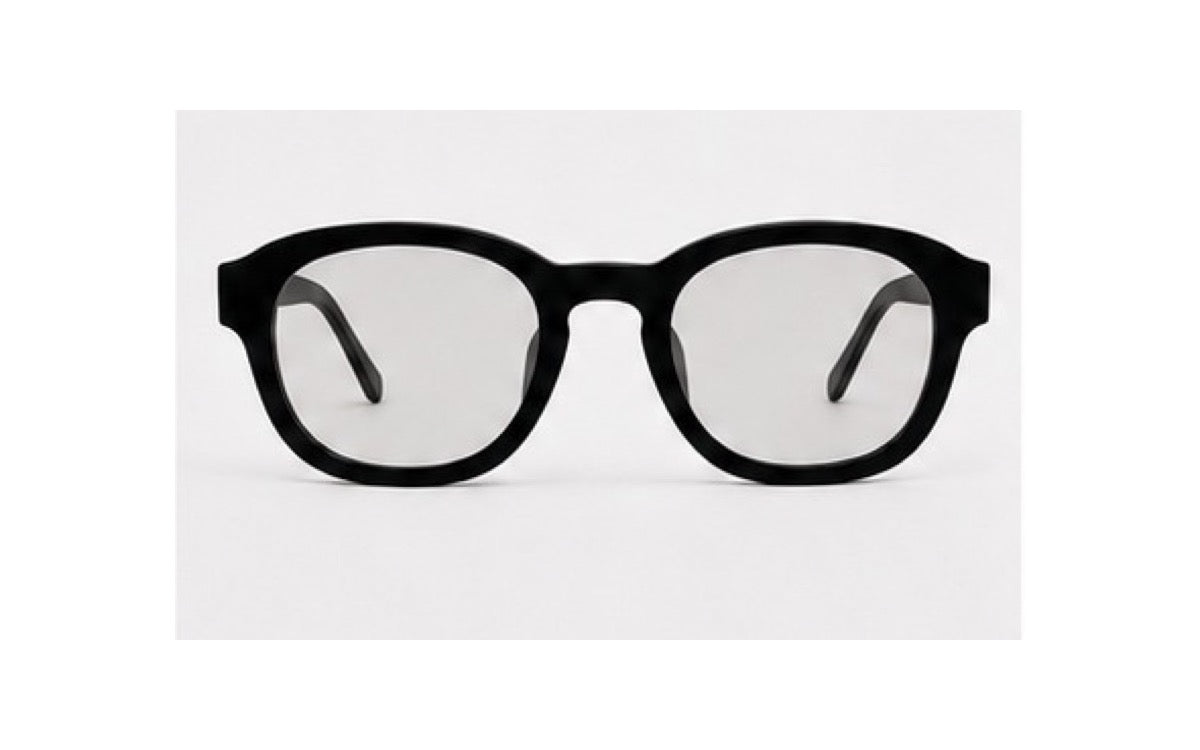 ATÉN Matte Black glasses with Everyday Mode lenses in a straight-on front view; both black temple tips are visible behind the Everyday Mode lenses on a white background.